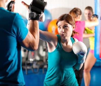 Men and women boxing for exercise