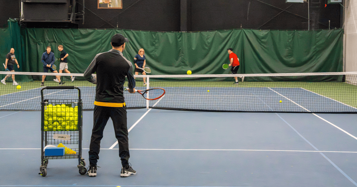 Adult summer tennis lessons at Elite Sports Clubs led by a tennis pro 