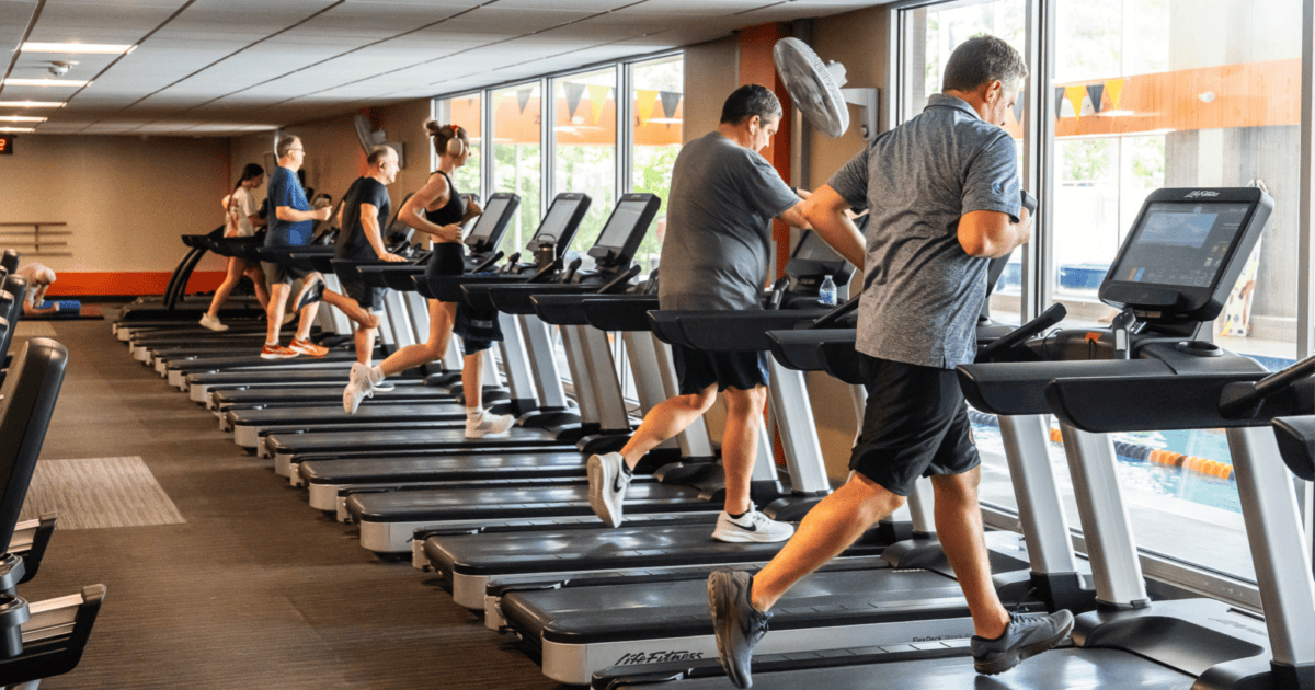 members running on treadmills practicing our marathon training tips